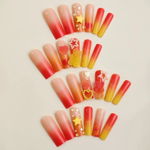 Long coffin false nails with orange gradient, 3D gummy bears and yellow star charms