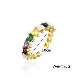 Detail view of gold-plated open ring with rainbow heart and pear-shaped zircons