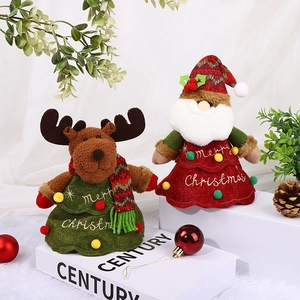 Plush Santa and Reindeer holiday figurines with Merry Christmas embroidery on display