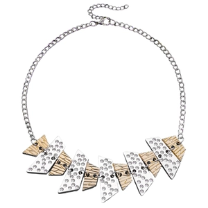 Detail of V-shaped alloy link necklace with rhinestones and gold textured patterns