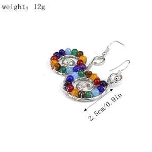 Detail shot of handmade wire wrapped earrings with colorful beads measuring 2.5cm in size