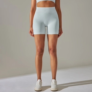 Detail of high-waist seamless knitted sports shorts in light blue with ribbed texture