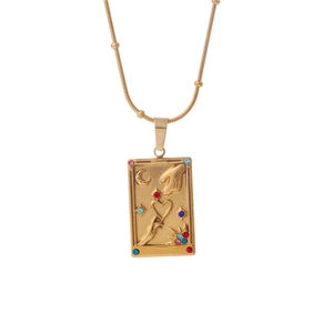 Gold tarot card pendant necklace with celestial motifs and colorful rhinestones
