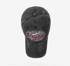 Detail of vintage washed denim baseball cap with distressed embroidered logo patch
