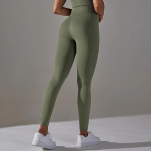Detail of high waisted seamless yoga leggings with olive green honeycomb texture