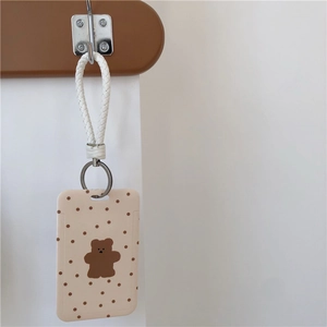 Cute beige polka dot bear plush card holder with white woven lanyard and metal keychain