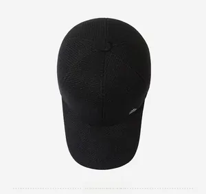 Top down view of black baseball cap showing durable twill texture and crown stitching