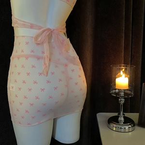 Detail of pink sheer mesh babydoll with red bow embroidery and lacing on back