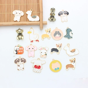 Flat lay of colorful cartoon animal alloy oil drip charms for DIY jewelry making