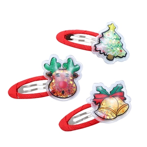 Set of 3 Christmas hair clips with tree, reindeer, and bell icons in red and gold