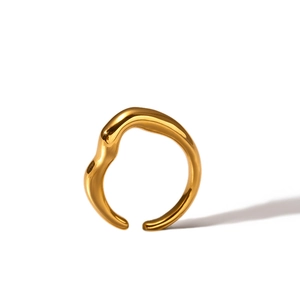 Detail of 18k gold plated stainless steel ring with polished irregular texture