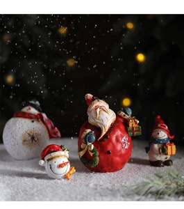 Detailed view of resin Santa and snowman figurines with high-quality painted textures