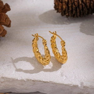 Chic 18K gold plated U-shaped twist hoop earrings on natural stone with pine cone