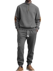 Detail of grey men's tracksuit set featuring 3D geometric knit texture and elbow patches