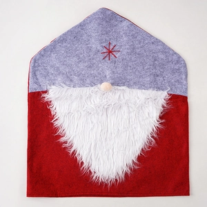 Detail of Christmas chair cover with grey felt hat, star embroidery and white faux fur beard