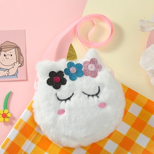 Detail of plush unicorn bag with golden horn and colorful sequin flower embellishments