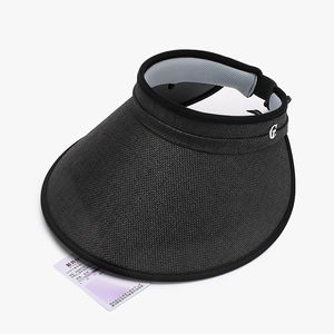 Women's black straw visor hat with UV protection test card and metal G detail