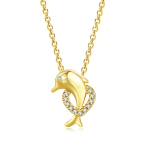 Close-up of golden dolphin jumping through a heart-shaped ring set with zircon stones