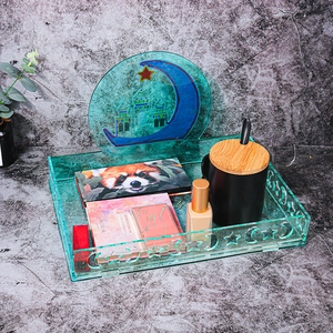 Green crescent moon storage tray with star and mosque motifs for Ramadan celebration