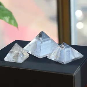 Set of three natural white crystal pyramids in various sizes for home decor energy