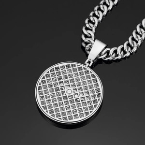 Detailed macro of silver iced-out pendant necklace with cuban chain on black reflection
