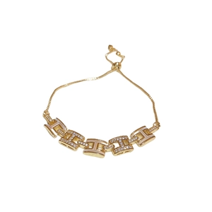 Bracelet doré avec maillons en H sertis de zircons et finition en émail blanc chic