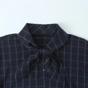 Women's dark blue plaid poplin shirt featuring a tie-up bow neckline and button details