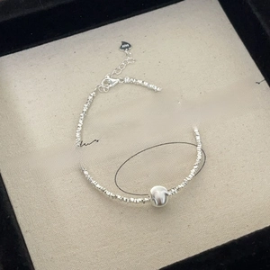 Macro shot of S925 sterling silver beaded bracelet with cat eye stone in a jewelry box
