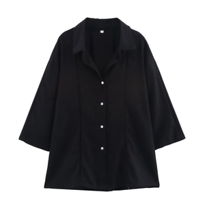 Detailed view of black linen V-neck shirt with button collar and short sleeves in size S