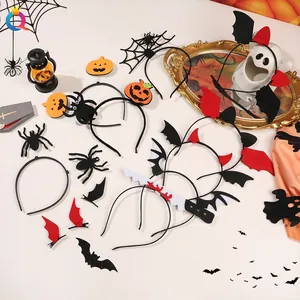 Detailed flat lay of Halloween hair accessories including pumpkin, spider, and bat motifs
