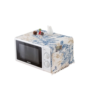 Floral cotton linen microwave dust cover with side storage pockets and white fringe trim