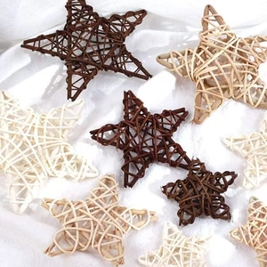 Handwoven rattan star decorations in natural and dark brown on white fabric