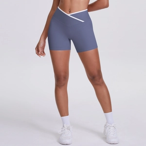 Close-up of grey blue high waist yoga shorts featuring a V-shaped crossover waistband