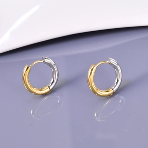 Minimalist two-tone gold and silver titanium steel hoop earrings with polished finish