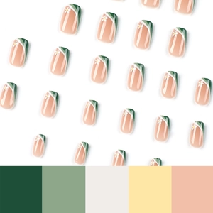 Green and white press-on nails with French diagonal tips and minimalist flower designs
