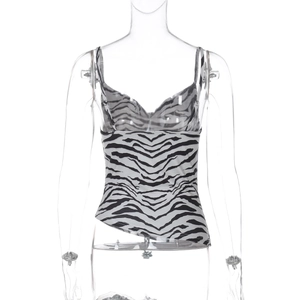 Detail of zebra print camisole featuring a cowl neck and black and white pattern design