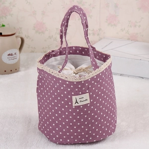 Purple polka dot canvas lunch bag with lace trim and secure drawstring closure