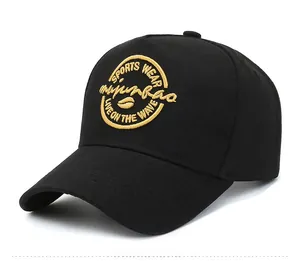 Close-up of black baseball cap with detailed yellow sports embroidery on front