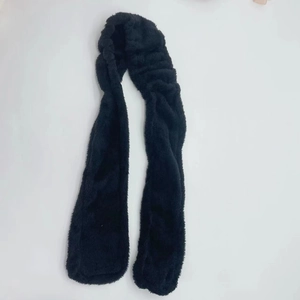 Detailed view of the soft black plush texture and flexible design of this heatless hair curler