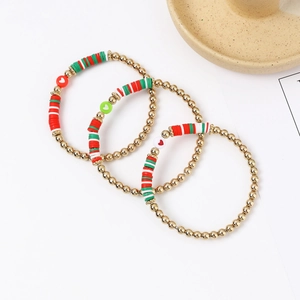 Three-piece Christmas beaded bracelet set with gold beads and heart accents in red and green