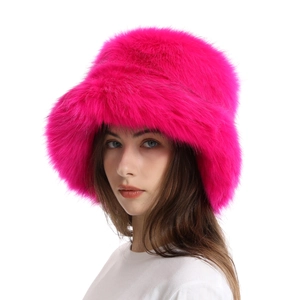 Detailed texture of thick hot pink faux fur on a warm winter bucket hat for women