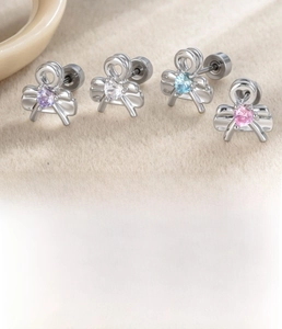 Detail showing heart zircon bow stud earrings specs in titanium steel and copper