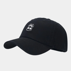 Close-up of a black cotton baseball cap with a white embroidered cartoon rabbit logo