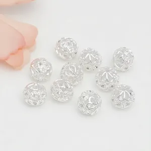 Detail of 10 silver hollow out beads with micro-set zircon and exquisite floral engraving