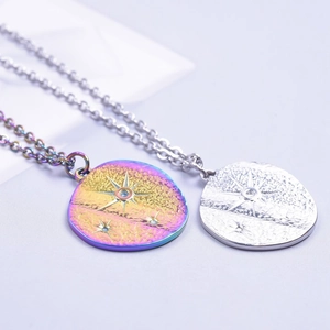 Macro detail of textured stainless steel round star pendants in silver and rainbow colors