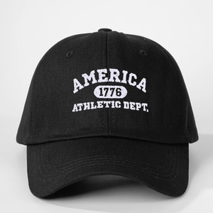 Close-up of America Athletic Dept embroidery on black cotton baseball cap