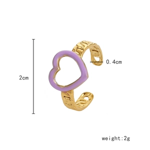 Detail of adjustable gold ring with purple enamel heart and woven texture, weighing 2g