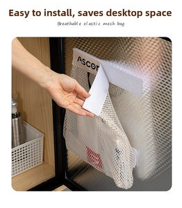 Close-up of the white mesh organizer bag showing the velcro strap installation process