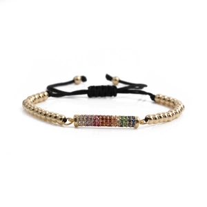 Adjustable gold bead bracelet with colorful rainbow cubic zirconia in a minimalist style