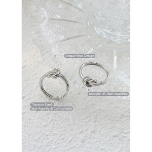Polished silver titanium steel knot ring with minimalist twisted design for women